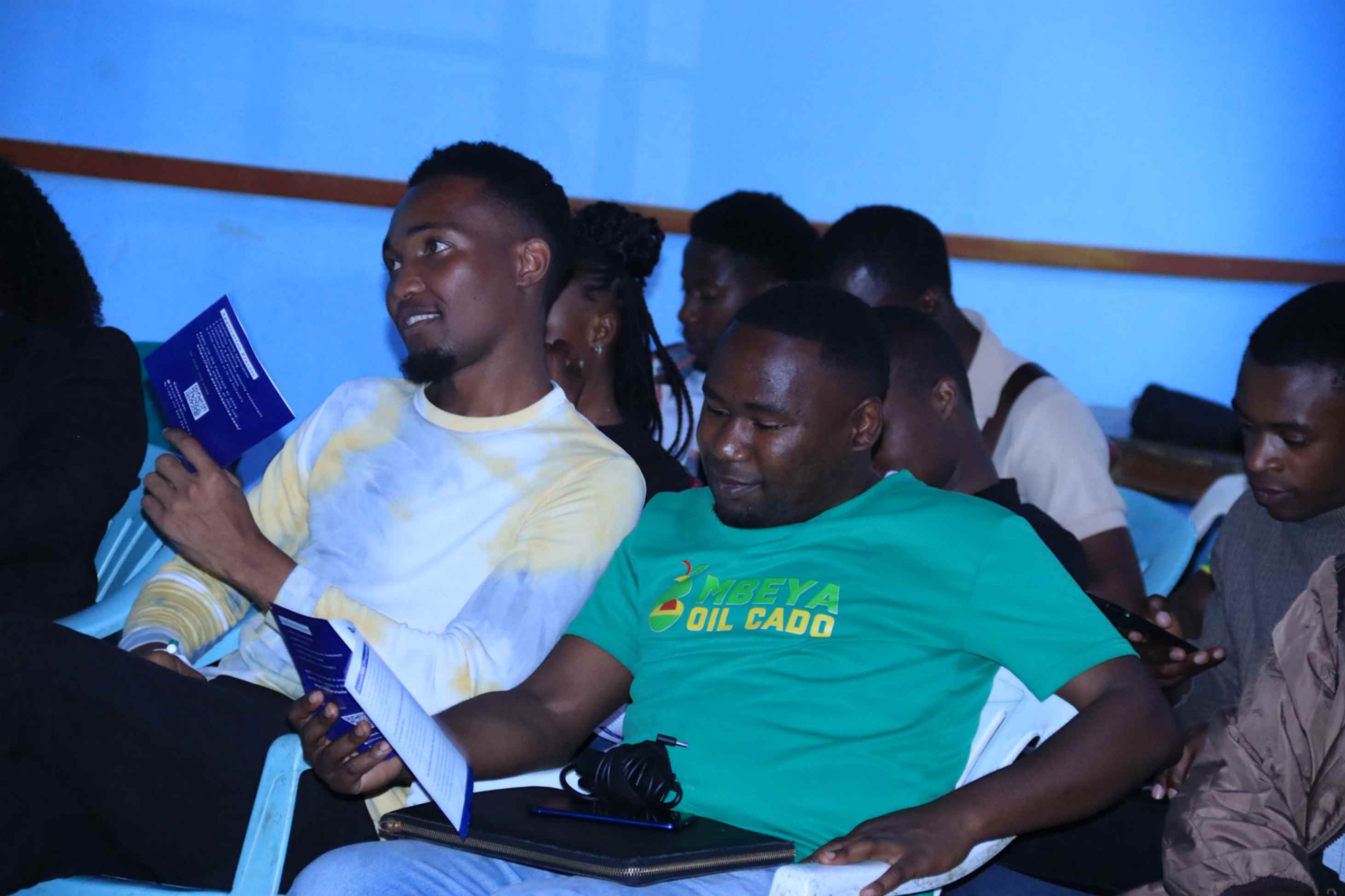 Participants reading program brochures