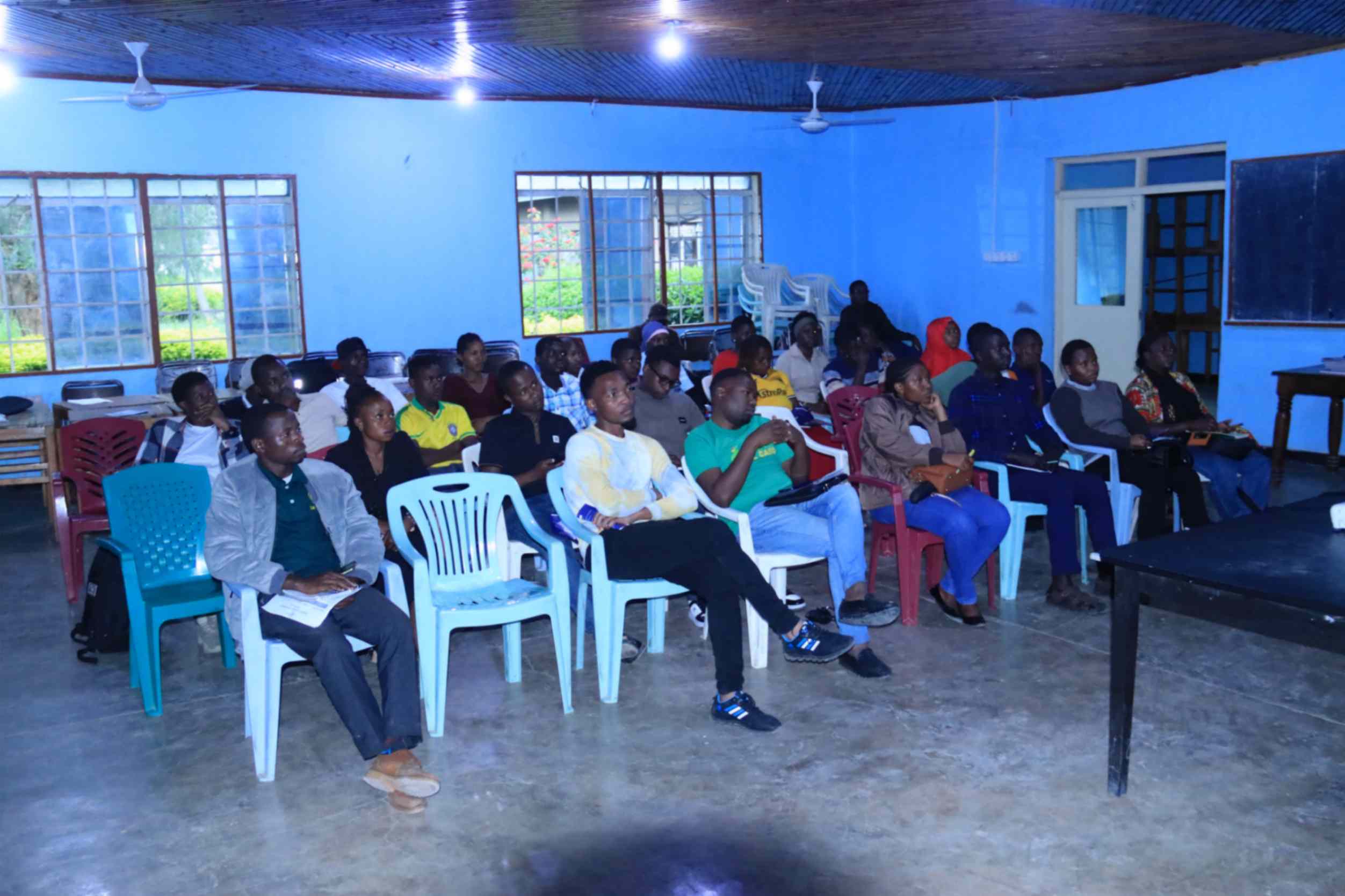 Wide shot of the Mbeya info session audience